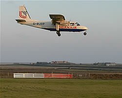 LoganAir Islander plane coming in to land at Sanday airstrip.  Roderick Thorne